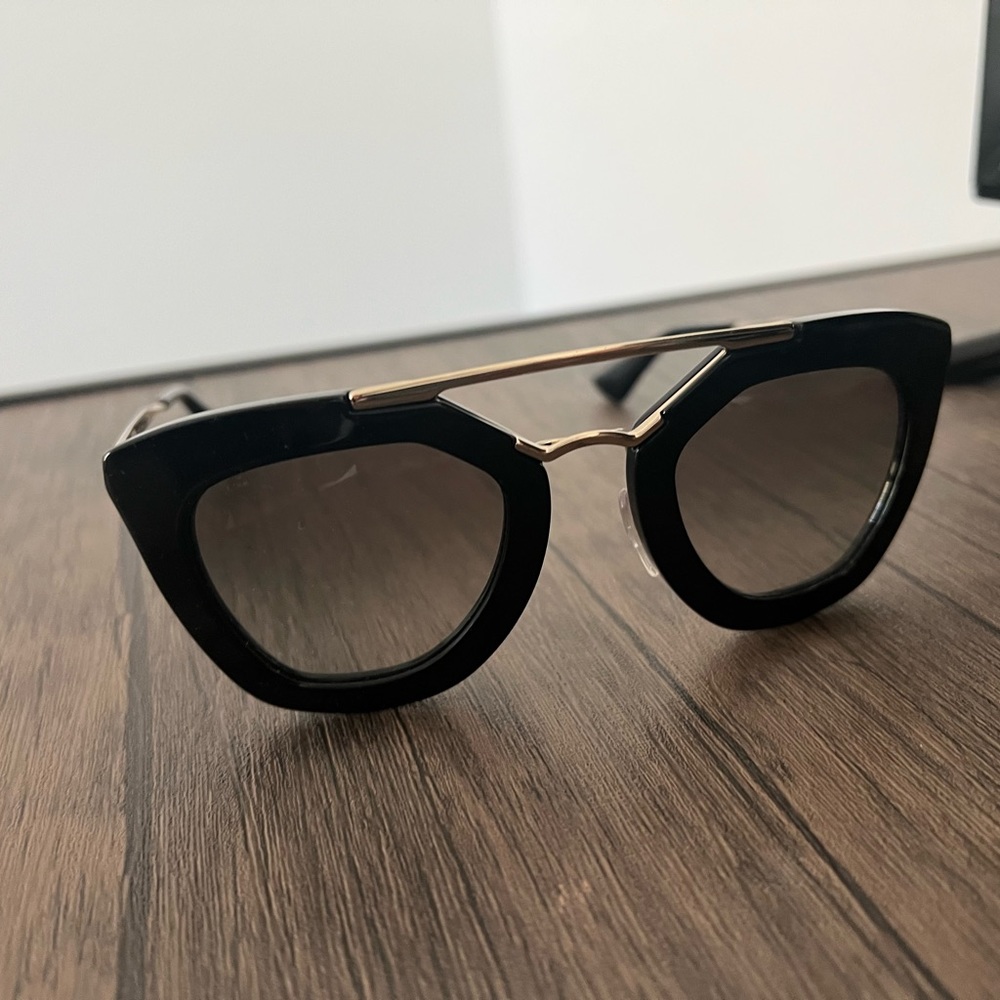 Black and gold Prada sunglasses